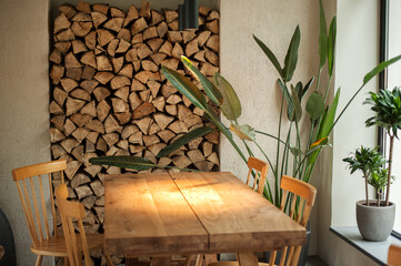 Cozy place, wooden table and chairs, window light and lamps