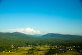 Fototapeta Tęcza - High cloud on the horizon with mountains, epic photo