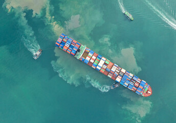 Container , container ship in export and import business and logistics. Shipping cargo to harbor by crane. Water transport International. Aerial view and top view.