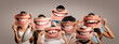 Leinwandbild Motiv group of happy people holding a picture of a mouth smiling on a gray background