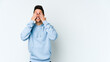 © Asier - Young caucasian man isolated on white background covers eyes with hands, smiles broadly waiting for a surprise.