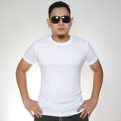 Wall Mural - Young Man Wearing Sunglasses and  White Shirt