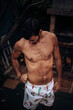 © Cavan Images - Fashion portrait of model man posing with nakek torso