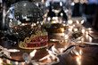© Sean Locke Photography/Stocksy - NYE: Party Table With Wine, Decorations, Disco Ball and 2020 Bal