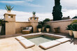 © VISUALSPECTRUM/Stocksy - Sunbed and Pool on Sunny Mediterranean Rooftop