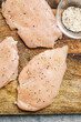 © CWP, LLC/Stocksy - Seasoned raw chicken breast
