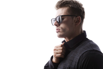 Wall Mural - Portrait of beautyful guy on white background. High fashion model posing in studio. Attractive man in classic suit and sunglasses.