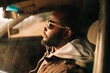 © Alexey Klementiev/Stocksy - young african american man in the car
