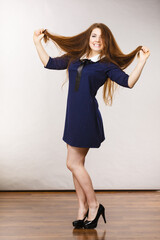 Wall Mural - Happy positive woman with long brown hair