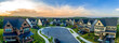 © tamas - Aerial sunset panoramic view of newly built high end luxury single family alp style house community at Lake Linganore Oakdale surrounding a cul-de-sac neighborhood street in Maryland USA