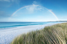 A Rainbow Over The Sea. Bay Of Fires. Tasmania. Australia.
