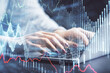© peshkova - Double exposure of businesswoman hands typing on computer and forex chart hologram drawing. Financial analysis concept.