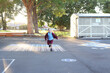 © Claire Bonnor/Austockphoto - Boy running through the school playground