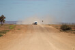 © Lisa Alexander/Austockphoto - Car and caravan being driven along a wide outback road