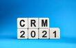 © Aksana Kavaleuskaya - CRM 2021 years on wooden cubes on a blue background