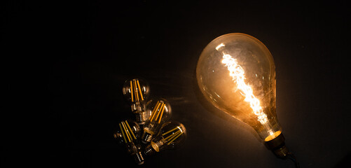 light bulbs on dark background idea and innovation