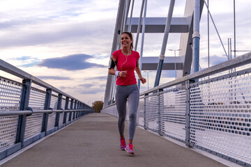 Wall Mural - Woman running outdoors.