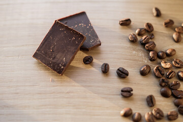 coffee beans and chocolate on wooden background. Flat lay top-down