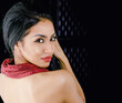 Beautiful exotic woman bare back and shoulder with face turned
