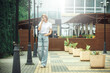 © VERSUSstudio - Summer sunny lifestyle fashion portrait. Young stylish hipster woman