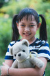 © arrowsmith2 - Smile little child girl hugging teddy bear with love