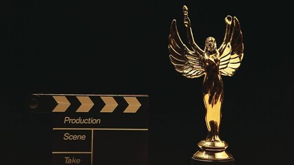 footage of clapper board gold angel