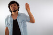 © Antonio Tanaka - young hispanic deaf man using sign language to communicate, on a white background wearing casual clothes