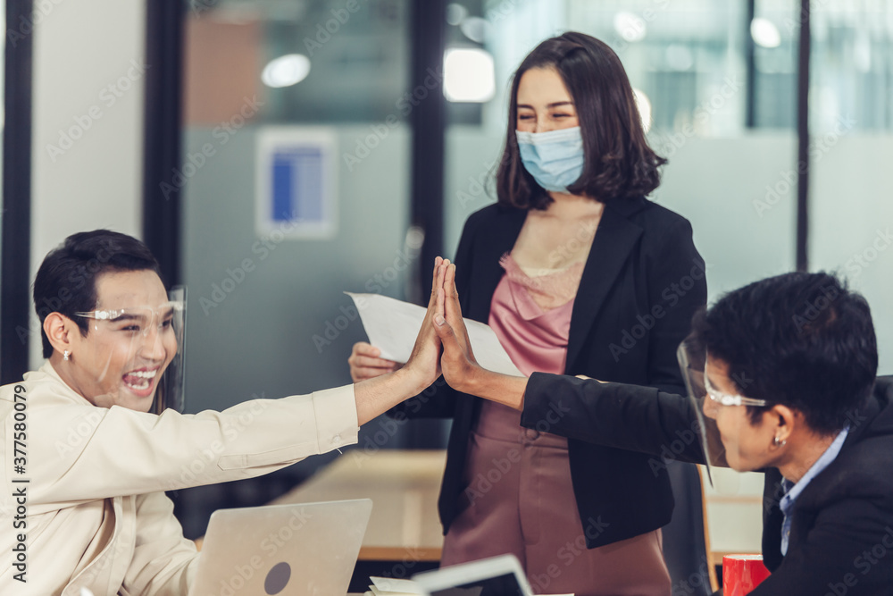 Business people giving each other high five and clapping. Teamwork ...