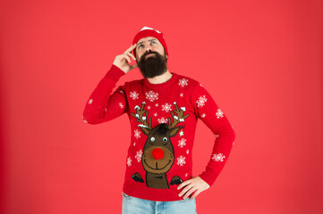 Wall Mural - thoughtful hipster touch beard. lost in thoughts. focused on choosing a gift. should i wear warm clothes. what weather is it today. bearded man knitted accessory. its christmas time.what to present