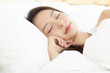 © sopradit - Asian women sleeping and sweet dream on white bed in bedroom