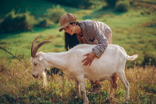 Woman With Goat On A Meadow At Sunset. Sensual. Happy Day. Farm.
