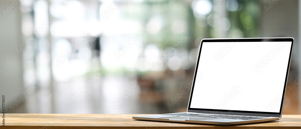 Laptop computer on wooden table with blank screen. Stock Photo | Adobe ...