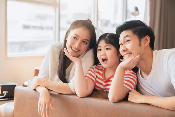 Wall Mural - Happy Attractive Young asian Family Portrait Healthy harmony in life family day concept asian family man woman and little girl having good time together.