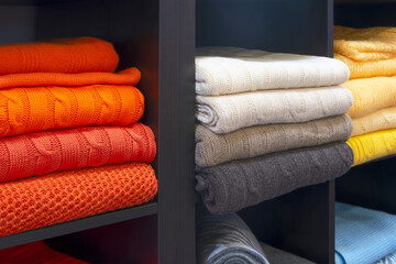 Leinwandbilder - Row of colorful clothes on shelf