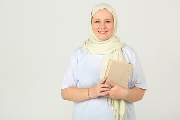 beautiful young plump woman in white muslim headscarf