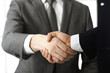 © Iryna - Unknown diverse business people are shaking hands finishing contract signing, close-up. Business and handshake concept