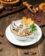 Wall Mural - Mushroom cream soup with toasts in a bowl