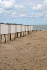 Beach houses on deserted sea shore blue sky