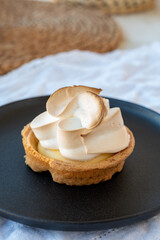 One piece of lemon tart with white eggs meringue