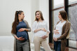 © Andrii - A group of young pregnant girls communicate in the prenatal class. Care and consultation of pregnant women