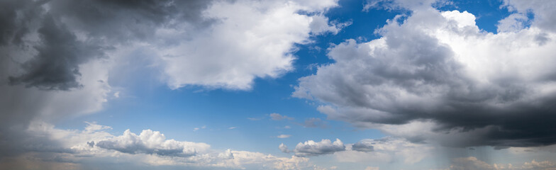 White cumulus clouds in blue sky panoramic high resolution background