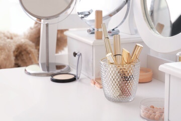 Set of decorative cosmetics on dressing table