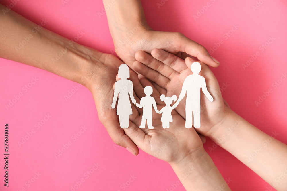 Hands of family with human figures on color background