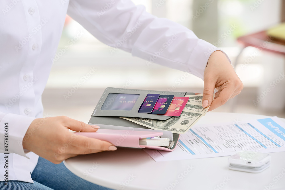 Woman with travel organizer at table
