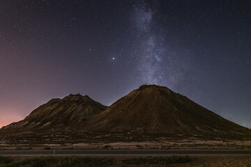 Wall Mural - starry sky with milky way galaxy over mountains