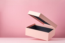 Pink Open Gift Box Isolated On Pink Background. Empty Gift Container. Blank Mock Up With Flying Box.