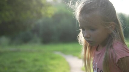 close-up of a beautiful girl in a summer forest.