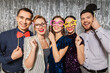 © Syda Productions - celebration, fun and holiday concept - happy friends posing with party props