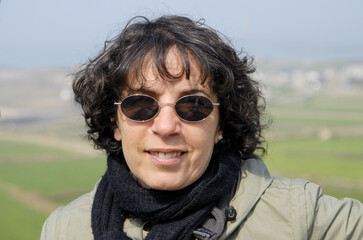 Sticker - portrait of mature brunette with sunglasses