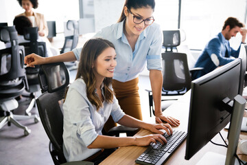 group of business people working together, brainstorming in office